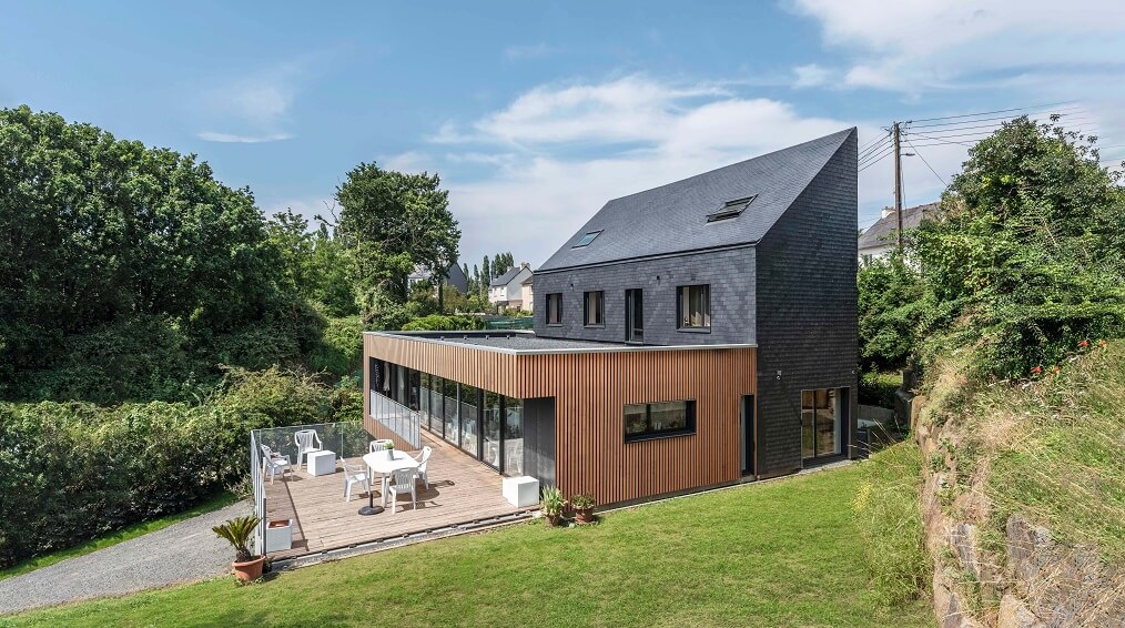 découvrez l'élégance intemporelle de nos maisons en ardoise, alliant esthétique et durabilité. explorez des designs uniques qui mettent en valeur la beauté naturelle de ce matériau, idéal pour une habitation chaleureuse et accueillante.